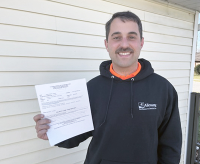 picture of Shane Congrad holding his certificate